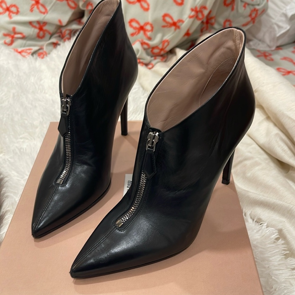 Miu Miu black leather zip up booties. Size 38 with a 3.5” heel. Includes box.